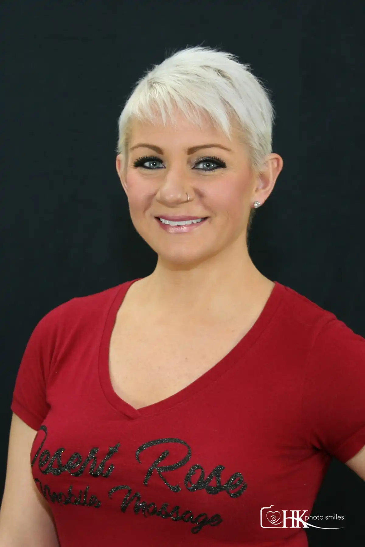 female short hair with black backdrop headshot photo
