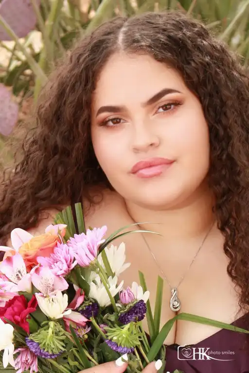 Female high school senior photo session close up with flowers
